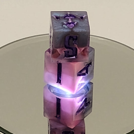 Transparent cylindrical object with embedded numbers and purple accents on a neutral background