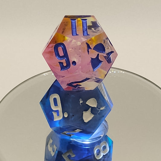 Colorful polyhedral dice on a reflective surface