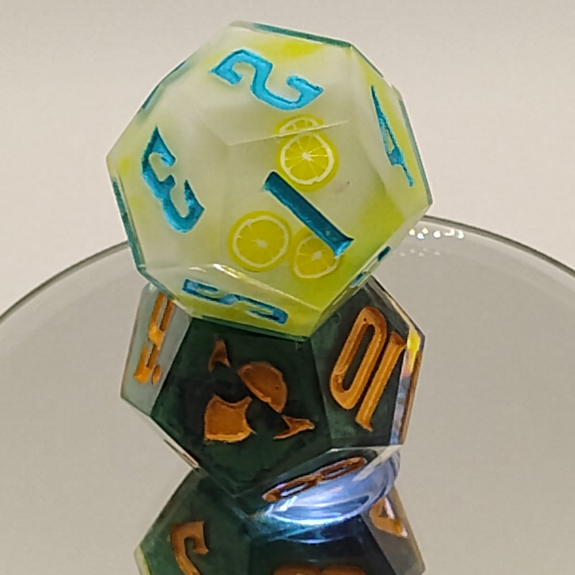 Colorful polyhedral dice on a reflective surface