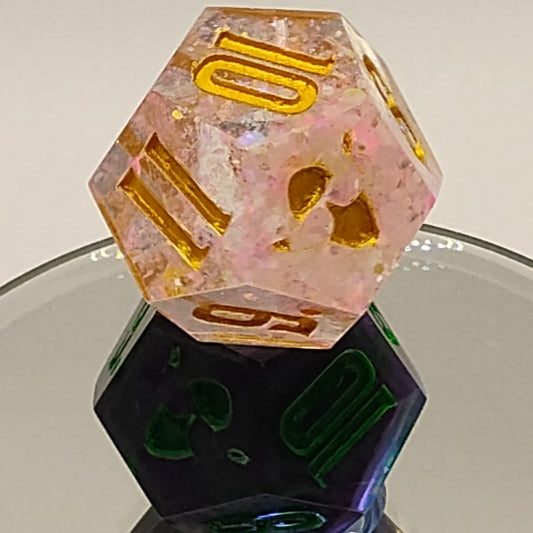 Close-up of two polyhedral dice with colorful and textured surfaces.