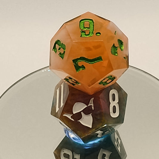 Close-up of polyhedral dice with different colors and numbers on a reflective surface.