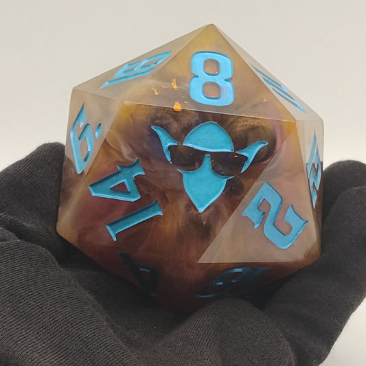 Translucent dice with blue numbers held by a gloved hand against a neutral background