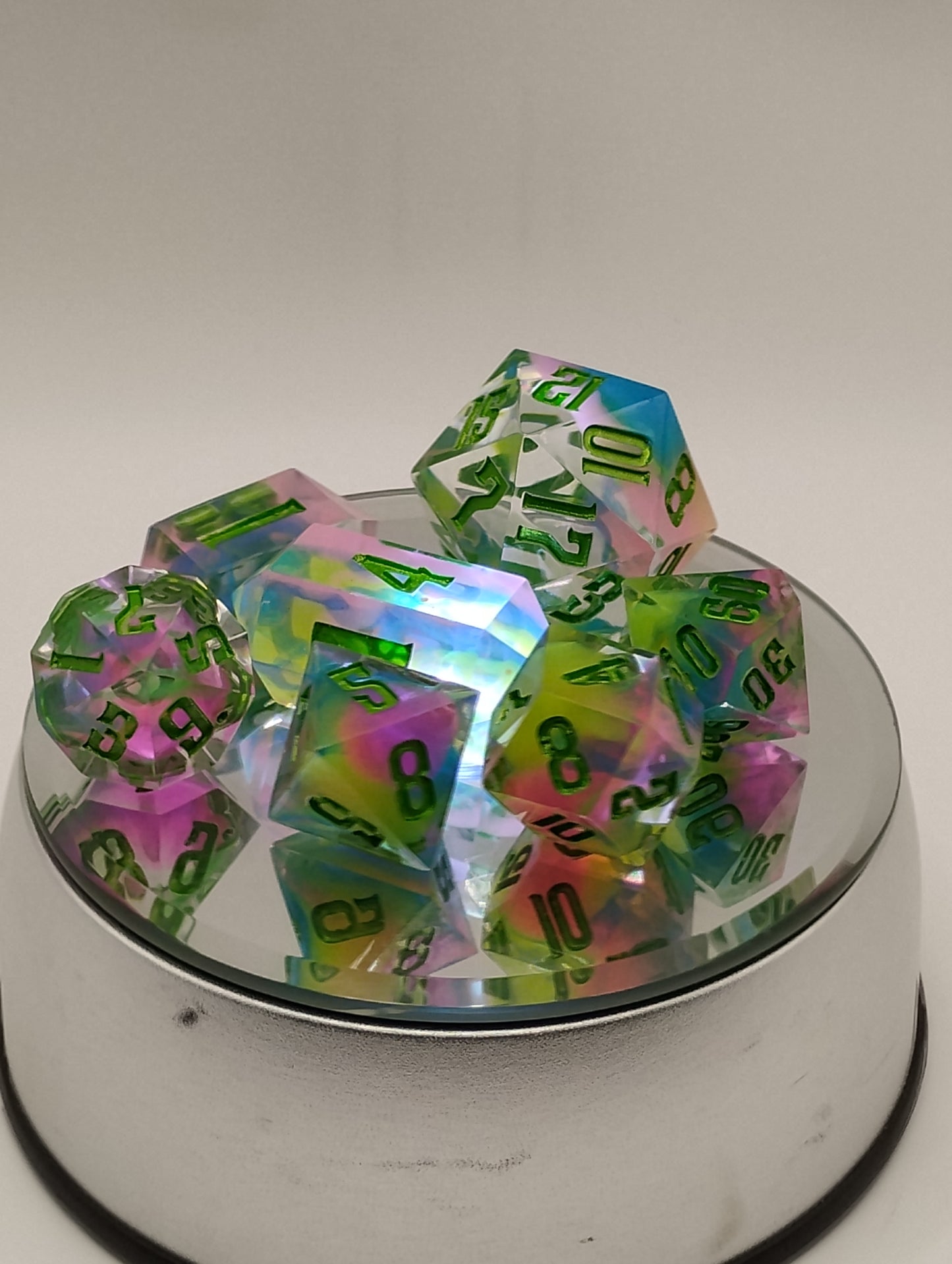 BLACKLIGHT REACTIVE Colorful Catastrophe Dice Set – Translucent RPG Dice with Green Numbers for Dungeons & Dragons and TTRPGs