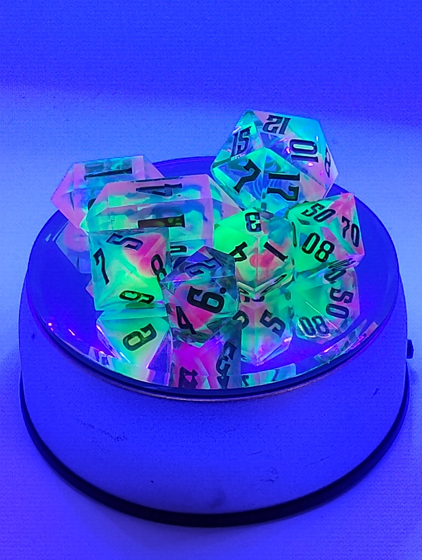 BLACKLIGHT REACTIVE Colorful Catastrophe Dice Set – Translucent RPG Dice with Green Numbers for Dungeons & Dragons and TTRPGs