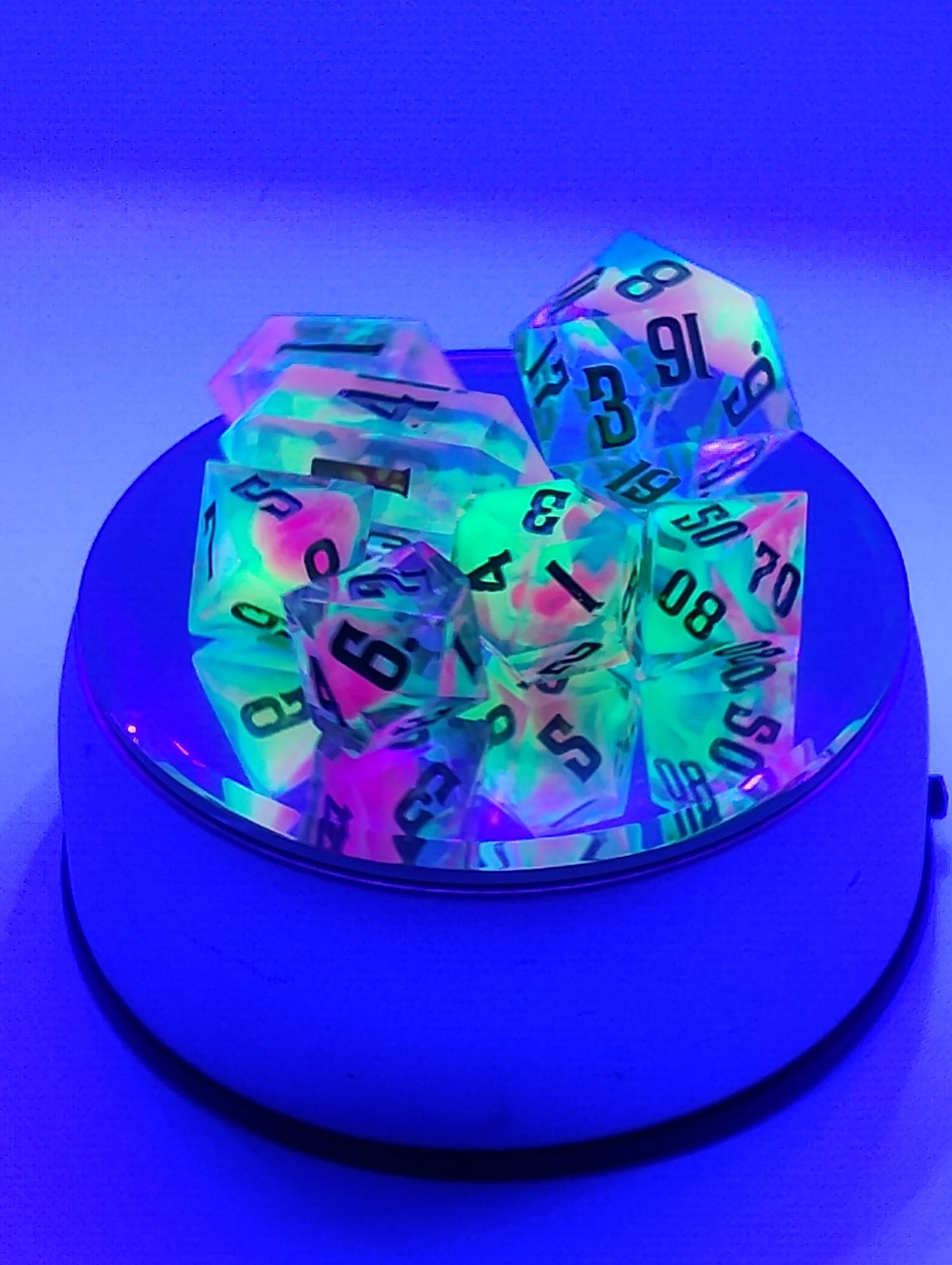 BLACKLIGHT REACTIVE Colorful Catastrophe Dice Set – Translucent RPG Dice with Green Numbers for Dungeons & Dragons and TTRPGs